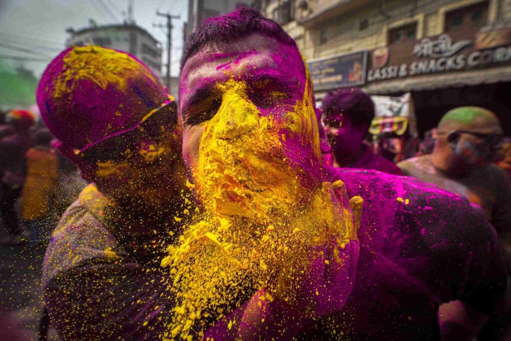 People Apply Color Powder On Each Other As They Celebrate Holi Festival In Guwahati, India, Friday, March 14, 2025.